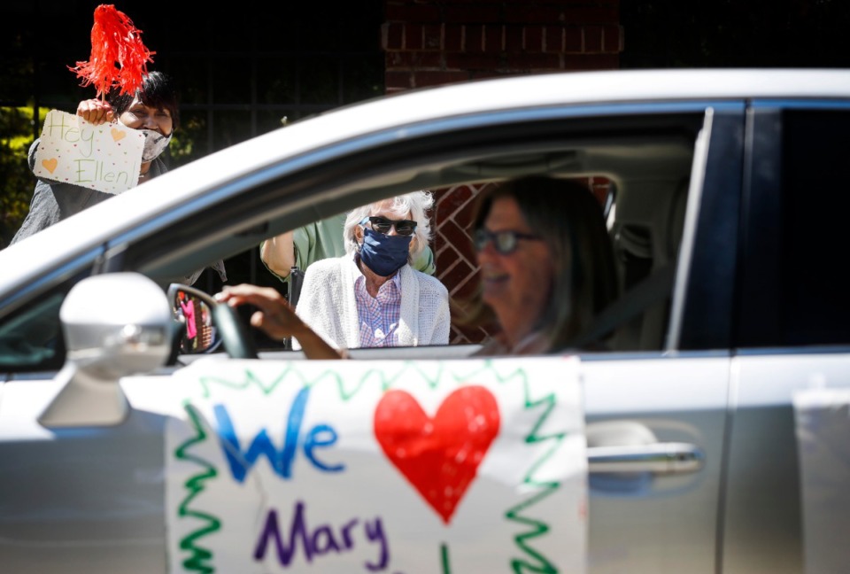 <strong>Assisted living and skilled nursing residents from Trezevant Manor wave to family members, who paraded by them on April 30, 2020. Residents from the Midtown retirement community have not seen family members since the facility went on lockdown due the COVID-19 outbreak.</strong> (Mark Weber/Daily Memphian)