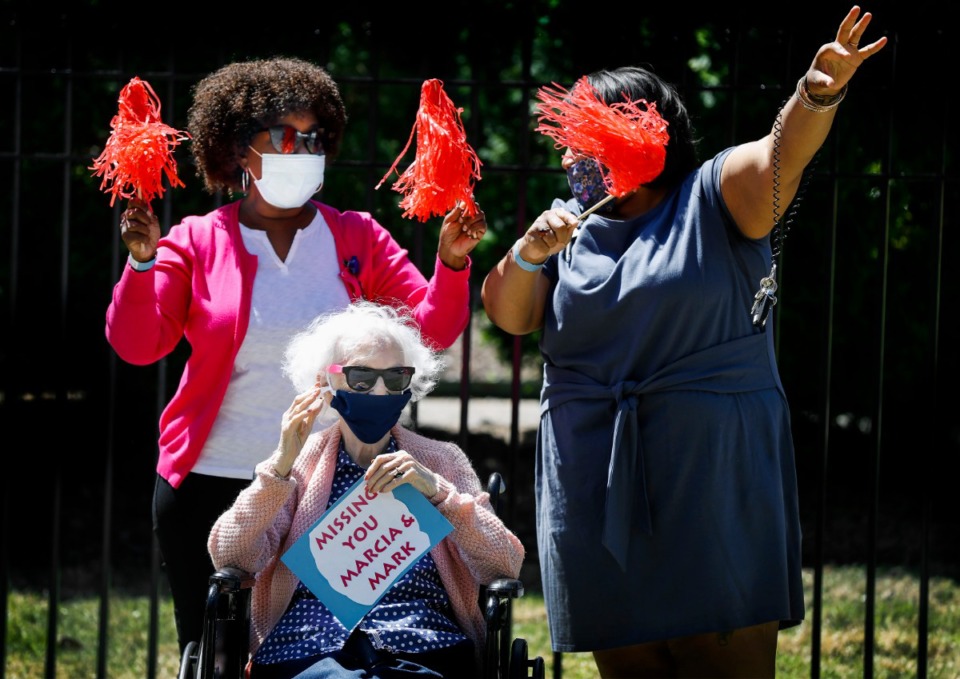 <strong>Assisted living and skilled nursing residents from Trezevant Manor wave to family members who paraded by them on April 30, 2020. Residents from the Midtown retirement community have not seen family members since the facility went on lockdown due the COVID-19 outbreak.</strong> (Mark Weber/Daily Memphian)
