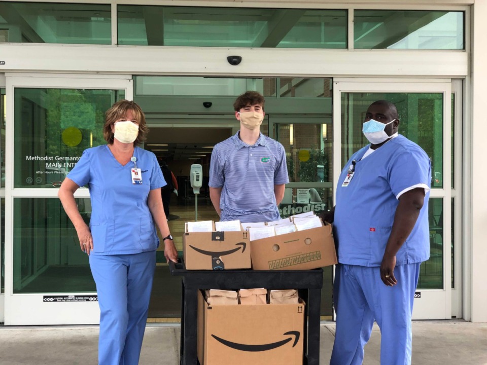 <span><strong>Graham Oldershaw delivers goody bags to Germantown Methodist Hospital. The bags contain chapstick, food and cards.</strong> (Submitted)</span>