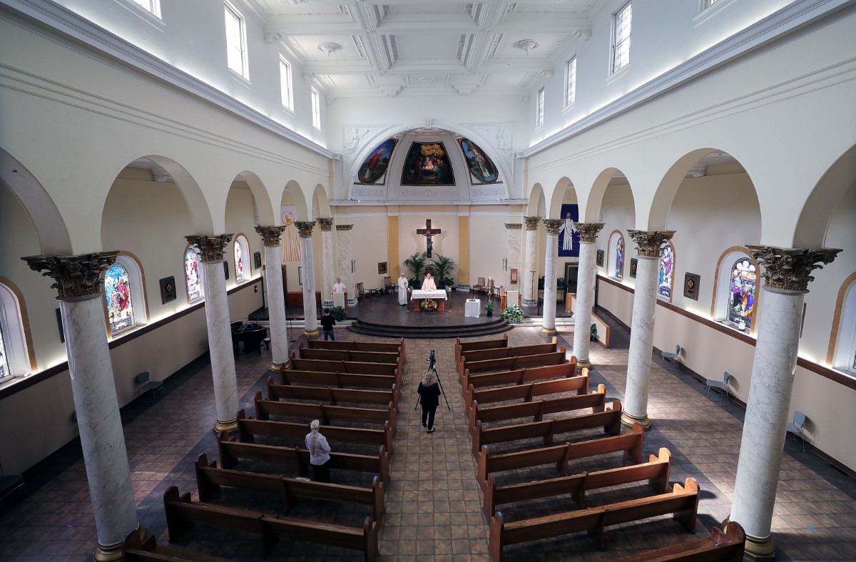 <strong>Monsignor Val Handwerker delivers a virtual sermon to the parishioners watching safely from home at St. Patrick Catholic Church May 3, 2020.</strong> (Patrick Lantrip/Daily Memphian)