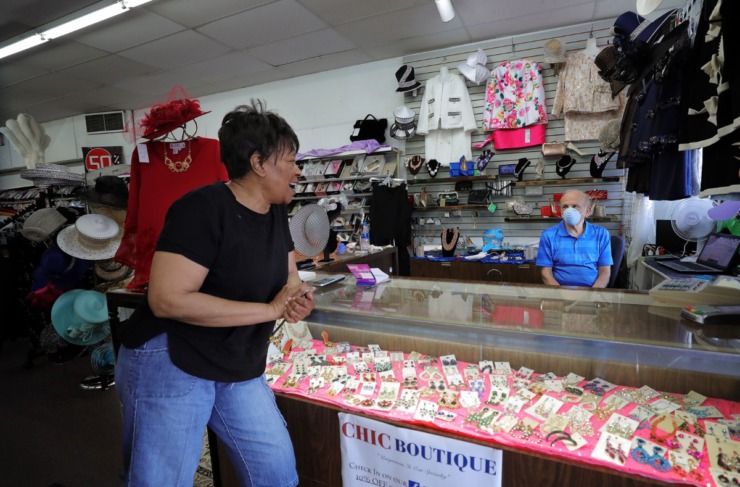 <strong>Dollie Massey jokes with her friend Mehdi Mostafavi who owns the ladies clothing store Chic Boutique in Whitehaven May 4, 2020.</strong> (Patrick Lantrip/Daily Memphian)