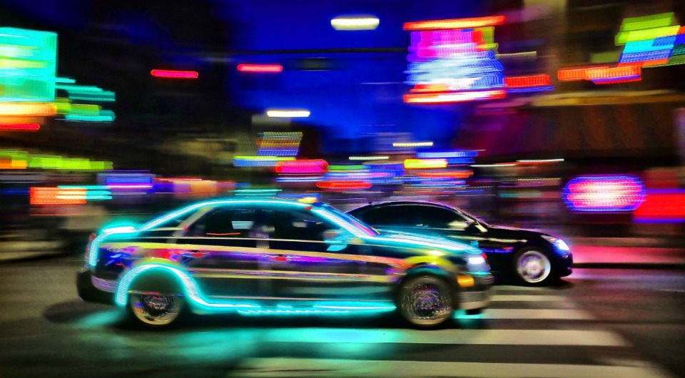 <strong>Muscle cars pass by the lights on Beale Street while cruising B.B. King Boulevard in Downtown Memphis on May 9, 2020. Police are cracking down on illegal street races that have popped up recently around the city.</strong> (Jim Weber/Daily Memphian)