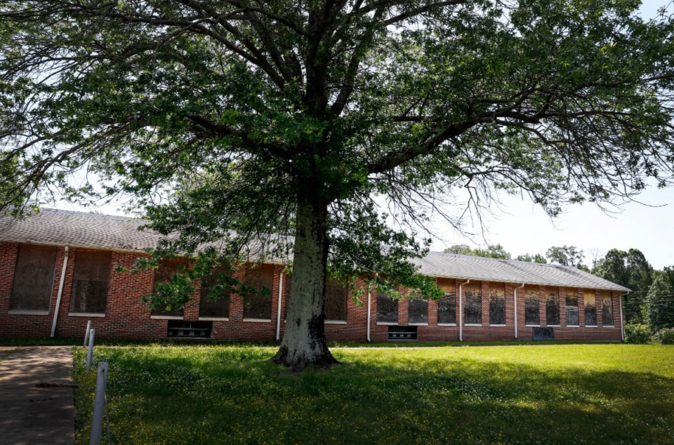 <strong>Boarded-up windows line the old Graves Elementary School gymnasium on Thursday, May 14. The Land Use Control Board recommended approval of a Graceland-related proposal to turn the school property into a high-tech production facility.</strong> (Mark Weber/Daily Memphian)