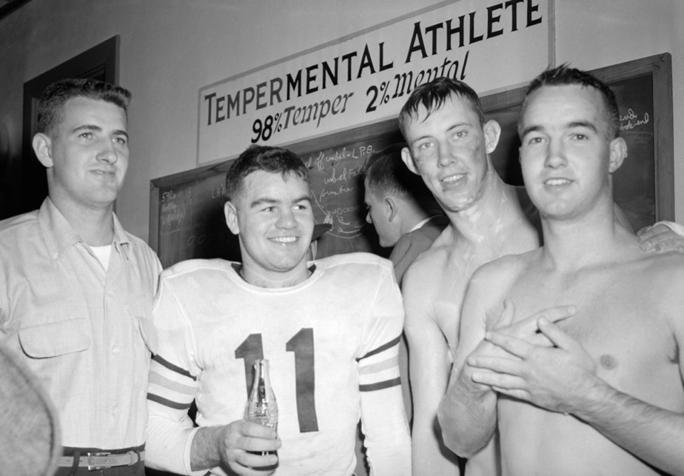 <strong>Pepper Rodgers (right) is with Georgia Tech football teammates in the locker room following a victory over the University of Mississippi at the Sugar Bowl in New Orleans, Jan. 1, 1953.&nbsp;Rodgers died May 14, 2020.</strong> (Dave Taylor/AP file)