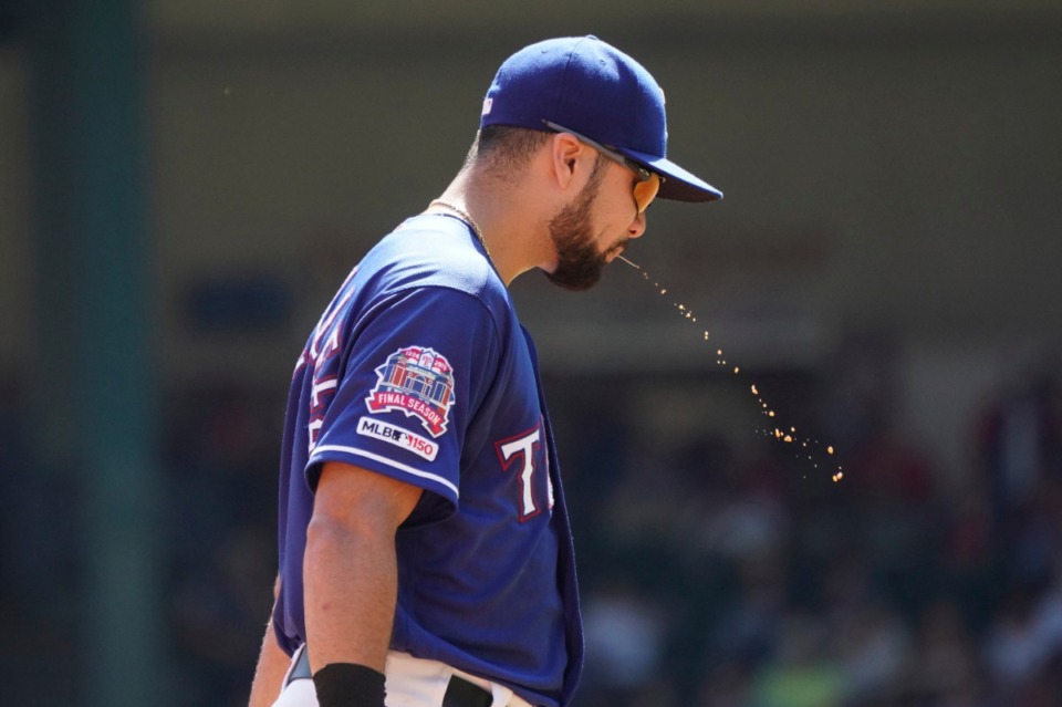 <strong>In this Sept. 26, 2019, file photo, Texas Rangers third baseman Isiah Kiner-Falefa demonstrates behavior that will be likely be frowned upon post-pandemic.</strong> (Louis DeLuca/AP file)