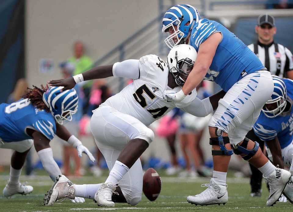 <strong>University of Memphis offensive lineman Dustin Woodard (53) faces off with AJ Wooten (54) during the Tigers matchup with UCF at Liberty Bowl Memorial Stadium on October 13, 2018.</strong> (Jim Weber/Daily Memphian)