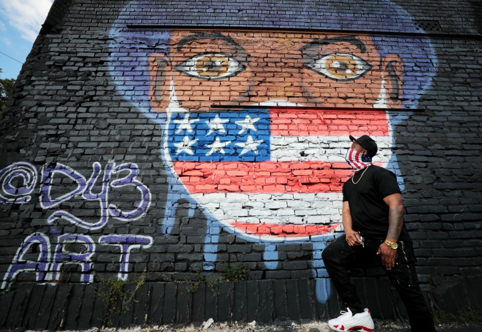 <strong>Artist David Yancy III poses in front of his Lamar Avenue mural on May 21, 2020.</strong> (Patrick Lantrip/Daily Memphian)