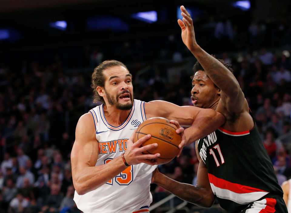 <strong>New York Knicks center Joakim Noah (13), making his season debut after a suspension for performance enhancing drugs, goes up against Portland Trail Blazers forward Ed Davis (17) during the first half of an NBA basketball game in New York, Monday, Nov. 27, 2017.&nbsp;</strong>(Kathy Willens/Associated Press)