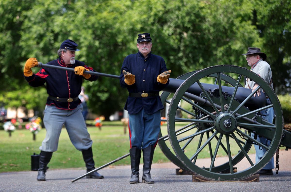 <strong>Members of Bankhead's Battery load a cannon (minus the artillery) to fire a salute to America's fallen troops during a Memorial Day ceremony at Memorial Park Cemetery May 25, 2020</strong>. (Patrick Lantrip/Daily Memphian)