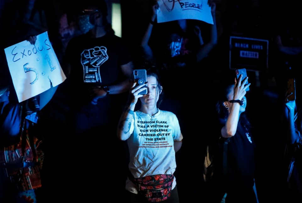 <strong>Protesters, rallying over the death of George Floyd, hold up photos and signs Downtown on Wednesday, May 27, 2020.</strong> (Mark Weber/Daily Memphian)