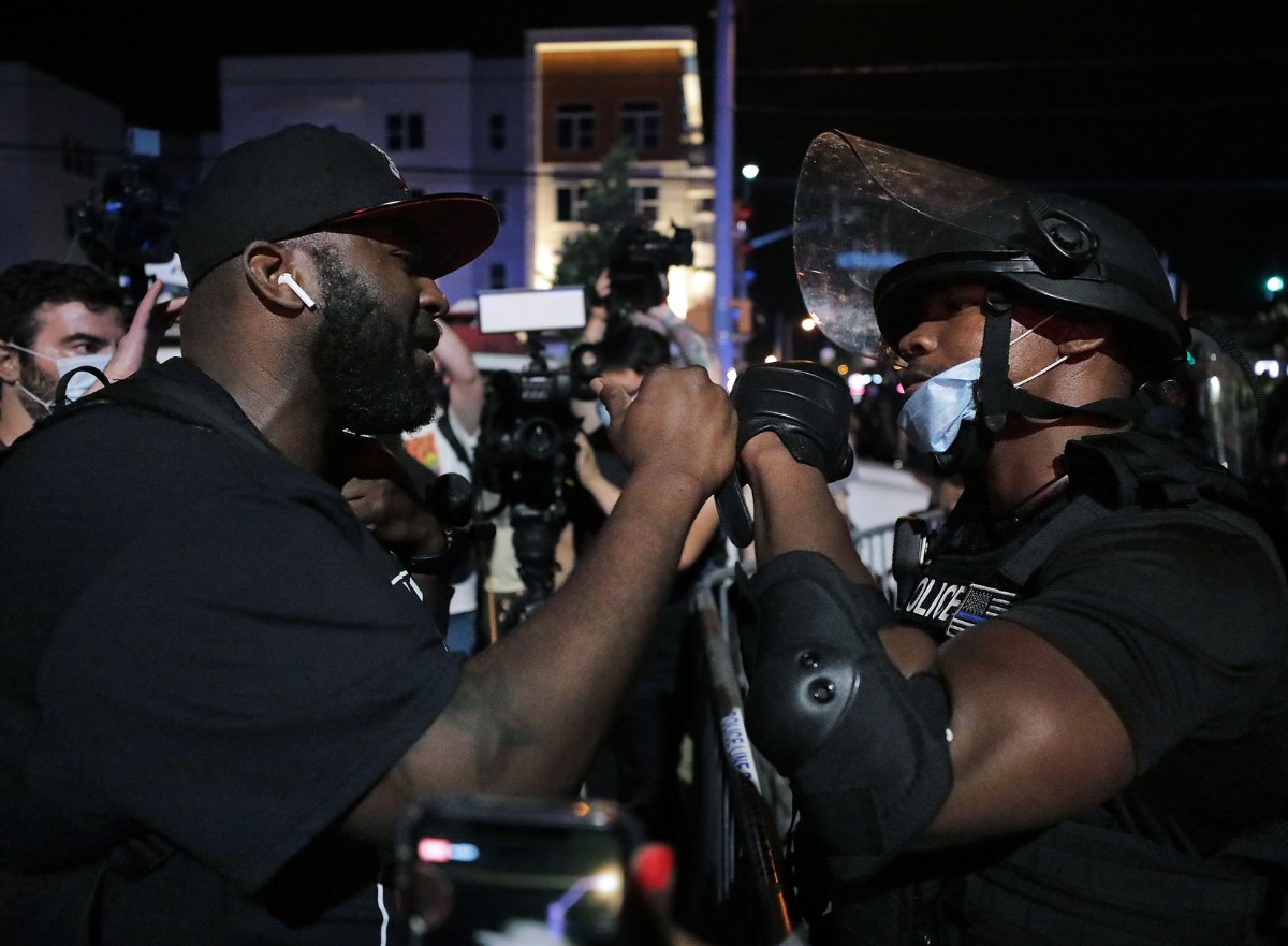 <strong>A Memphis Police officer fist bumps a protestor in an attempt to bring the May 28, 2020 protest over the death of George Floyd to a peaceful conclusion.</strong> (Patrick Lantrip/Daily Memphian)