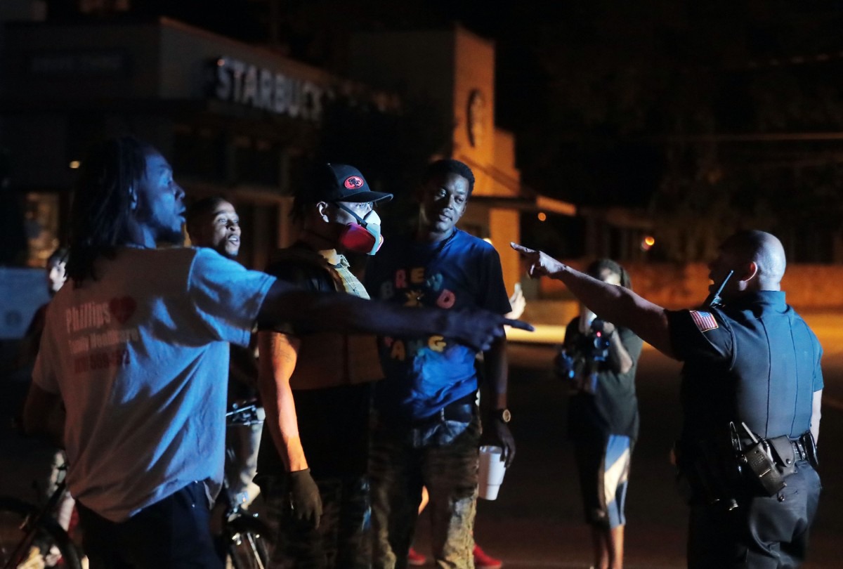 <strong>Despite the mostly peaceful evening, tensions began to run high as the protest wore one, as a man in a gas mask confronts police on Union Avenue during a May 28, 2020 protest over the death of George Floyd.</strong> (Patrick Lantrip/Daily Memphian)