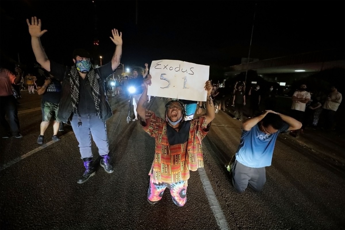 <strong>Protesters kneel in front of the Union Avenue police station in Memphis, Tennessee during a May 28, 2020 protest over the death of George Floyd.</strong> (Patrick Lantrip/Daily Memphian)