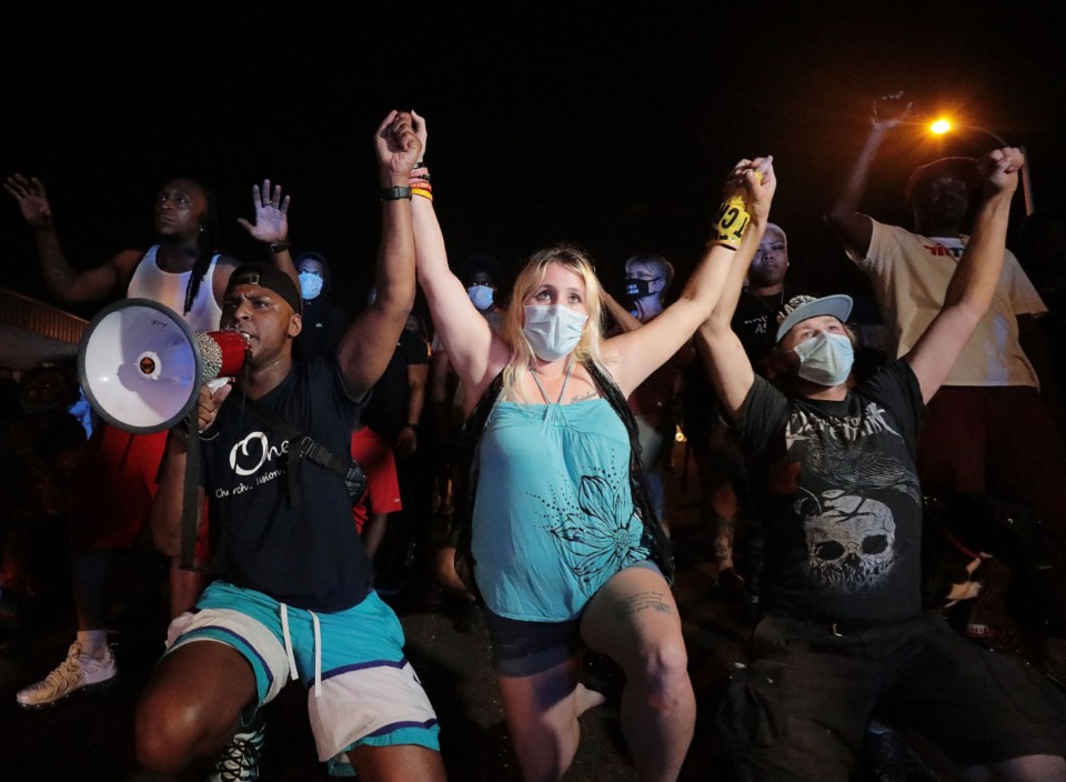 <strong>Protesters locked hands and kneeled while blocking Union Avenue in from of the Memphis Police Department Midtown station during a May 28, 2020 protest over the death of George Floyd.</strong> (Patrick Lantrip/Daily Memphian)
