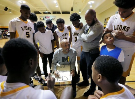 <strong>Memphis Academy of Health Sciences coach Vernard Watkins draws up play during a home victory against Trezevant High School in January 2020.</strong> (Patrick Lantrip/Daily Memphian file)