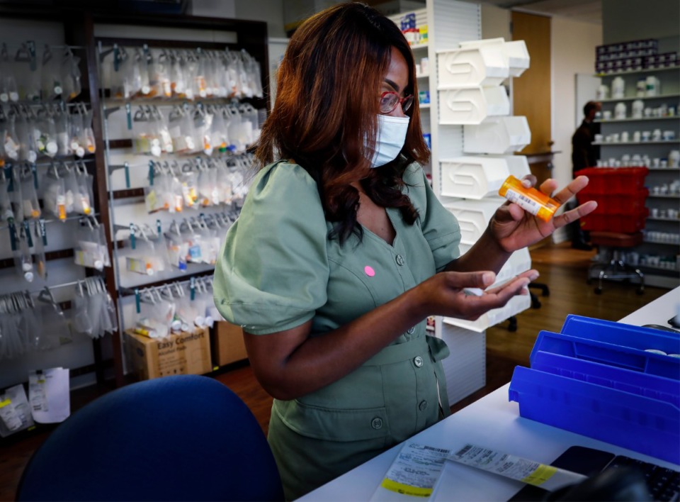 <strong>Dar Salud Care pharmacist Kimberly Brooks fills patient prescriptions orders on Thursday, May 28, 2020.</strong> (Mark Weber/Daily Memphian)