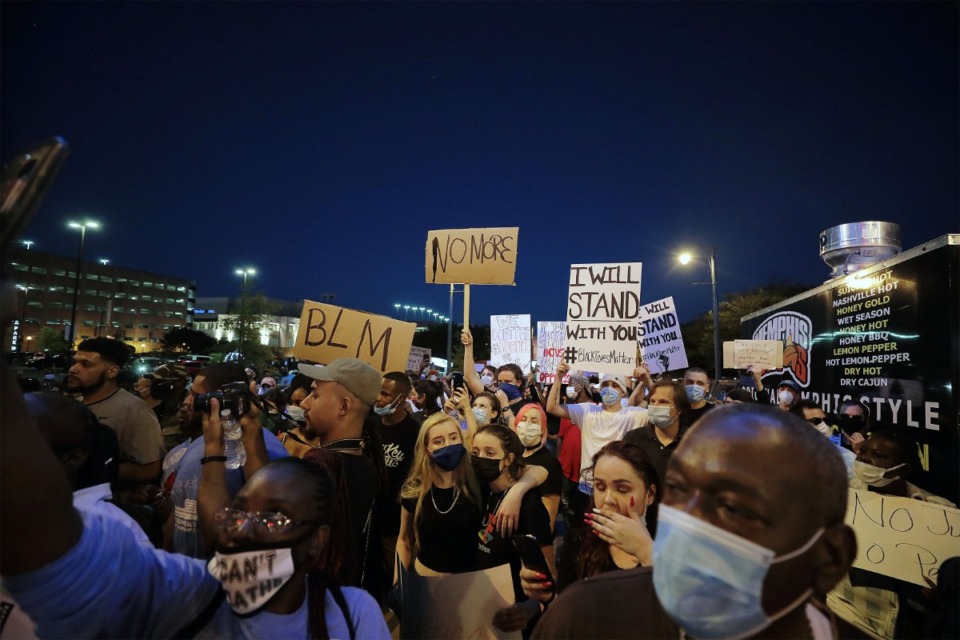 <strong>Two people hug during a May 29, 2020 march throughout Downtown Memphis to protest the murder of George Floyd by the Minneapolis Police.</strong> (Patrick Lantrip/Daily Memphian)