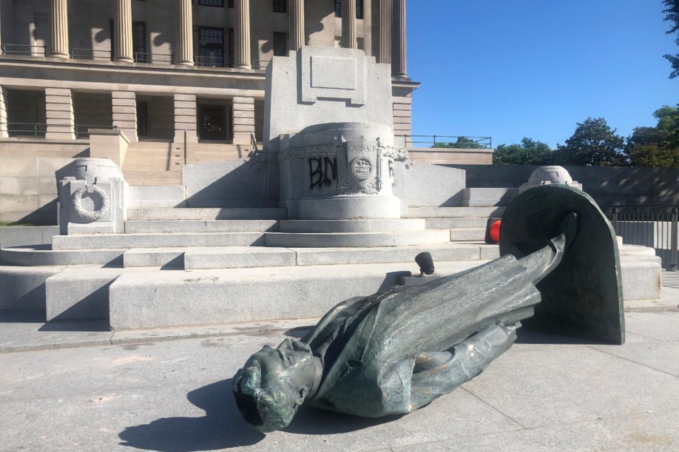<strong>Protesters toppled the statue of Edward Carmack outside the state Capitol after a peaceful demonstration turned violent, Sunday, May 31, 2020, in Nashville.</strong> (Kimberlee Kruesi/AP)