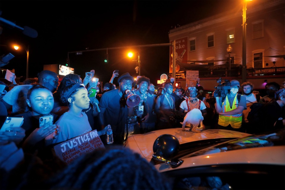 <strong>Protesters confront a Memphis Police officer in his car in Memphis during a protest on Sunday, May 31.</strong> (Patrick Lantrip/Daily Memphian)