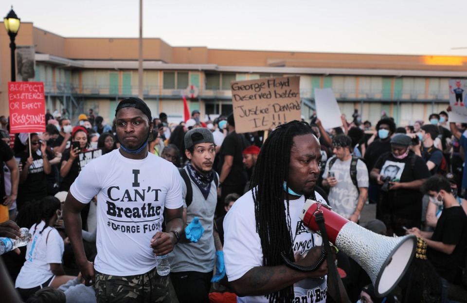 <strong>Frank Gottie (right) takes the microphone from Devante Hill effectively ending Hill's leadership of the march during a protest over the murder of George Floyd May 31, 2020.</strong> (Patrick Lantrip/Daily Memphian)