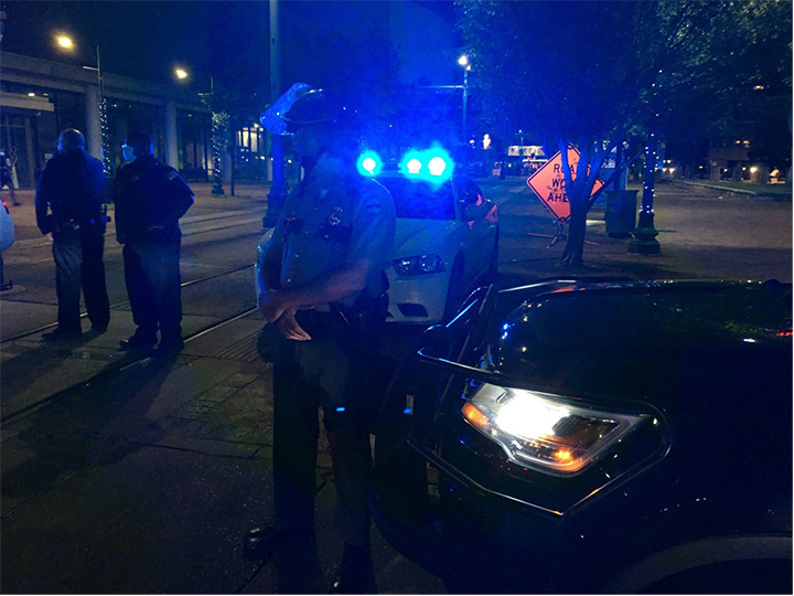 <strong>Around 8:30 the protest moved to Poplar Avenue. "We come in peace," the protesters told police.</strong> (Daily Memphian)