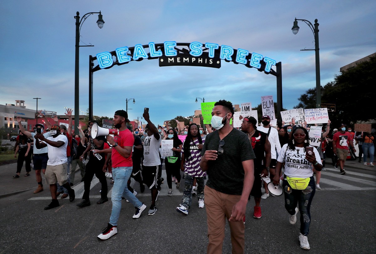 <strong>Protesters march under the Beale Street sign June 1, 2020. </strong>(Patrick Lantrip/Daily Memphian)