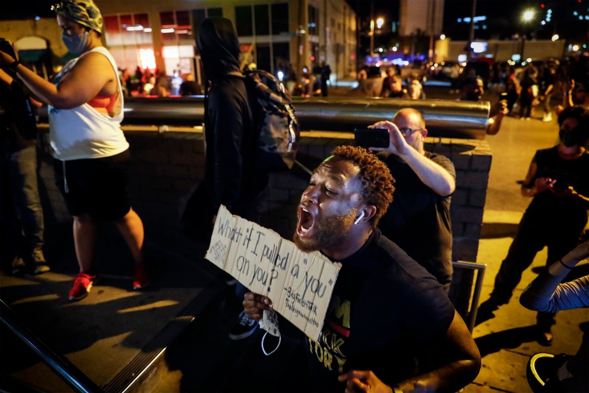 <strong>A protester yells at Memphis Police officers, who are inside the Shelby County Criminal Justice Center in Memphis on Monday, June 1, 2020, during a protest over the Minneapolis killing of George Floyd.</strong> (Mark Weber/Daily Memphian)