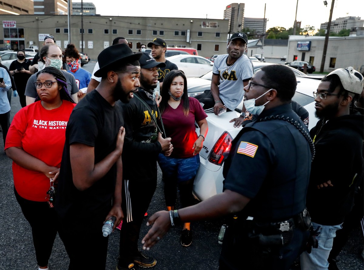 <strong>Activist Darin Abston (left) confronts a Memphis Police officers in Memphis on Monday, June 1, 2020. Protesters during a protest over the Minneapolis killing of George Floyd.</strong> (Mark Weber/Daily Memphian)