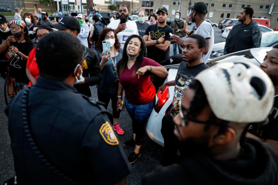 <strong>Protesters confront a Memphis Police officer in Memphis on Monday, June 1, 2020, during a protest over the Minneapolis killing of George Floyd.</strong> (Mark Weber/Daily Memphian)