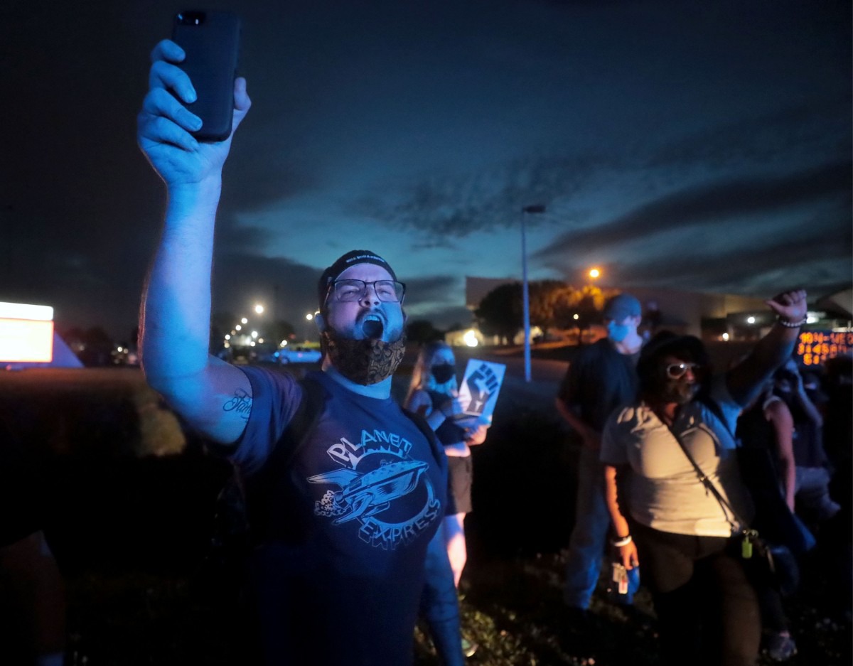 <strong>Protesters chant "no justice, no peace during a protest that shut down Germantown Parkway June 2, 2020 over the murder of George Floyd.</strong> (Patrick Lantrip/Daily Memphian)