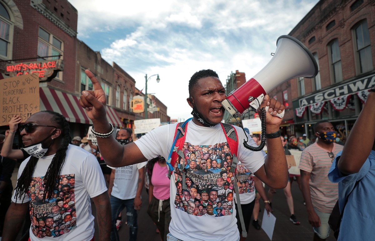 <strong>DeVante Hill marches down Beale Street June 7, 2020 during the twelfth day of protesting over the death of George Floyd.</strong> (Patrick Lantrip/Daily Memphian)