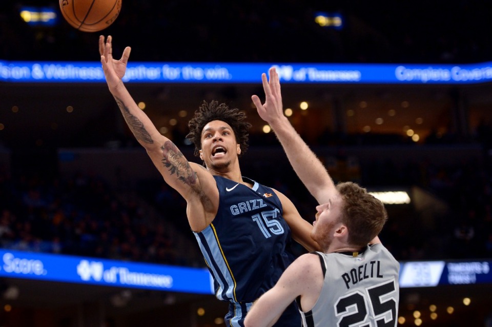 <strong>Memphis Grizzlies forward Brandon Clarke (15) shoots against San Antonio Spurs center Jakob Poeltl (25) during a January game at FedExForum.</strong> (AP file Photo/Brandon Dill)