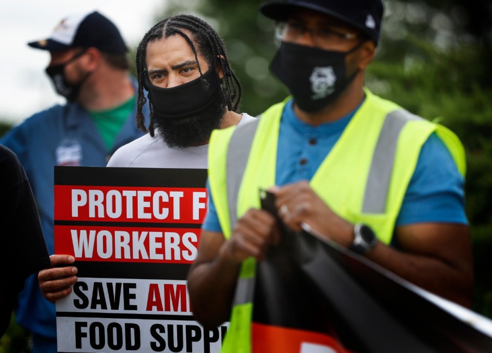 <strong>Kroger employee Chris Franceschi (middle) attends a protest on Wednesday, June 10, outside the Kroger Delta Division Distribution Center on Bledsoe Road. Teamsters&nbsp; union members called for more COVID-19 protections of workers and products in the food service supply chain.</strong> (Mark Weber/Daily Memphian)
