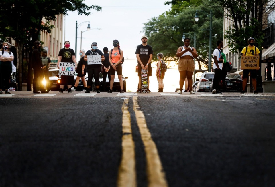 <strong>Protesters block the intersection of North Main Street and Monroe Avenue at the entrance of Flight Restaurant and Wine Bar on Saturday, June 13, 2020. Recent social media posts accused the restaurant of racism and sexism.</strong> (Mark Weber/Daily Memphian)