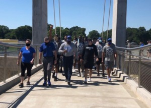 <strong>Tigers lead the way across the pedestrian bridge that spans Southern Avenue as they make their way from the university's South Campus at Park Avenue and Getwell Road to the Memphis State 8 plaque on the main campus.</strong> (Geoff Calkins/Daily Memphian)