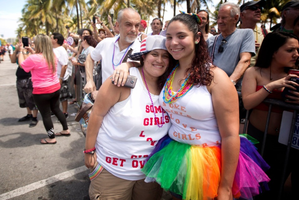 <strong>Violeta Proas and her partner, Steffan Casuo, hug as they watch the Miami Beach Gay Pride Parade in 2014.</strong> (AP file Photo/J Pat Carter)