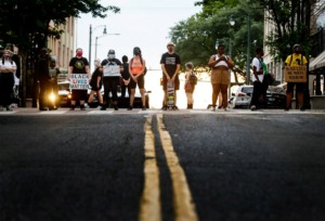 <strong>Protesters block the intersection of N. Main St. and Monroe Ave. at the entrance of Flight Restaurant and Wine Bar on Saturday, June 13, 2020. Recent social media posts accused the restaurant of racism and sexism.</strong> (Mark Weber/Daily Memphian)