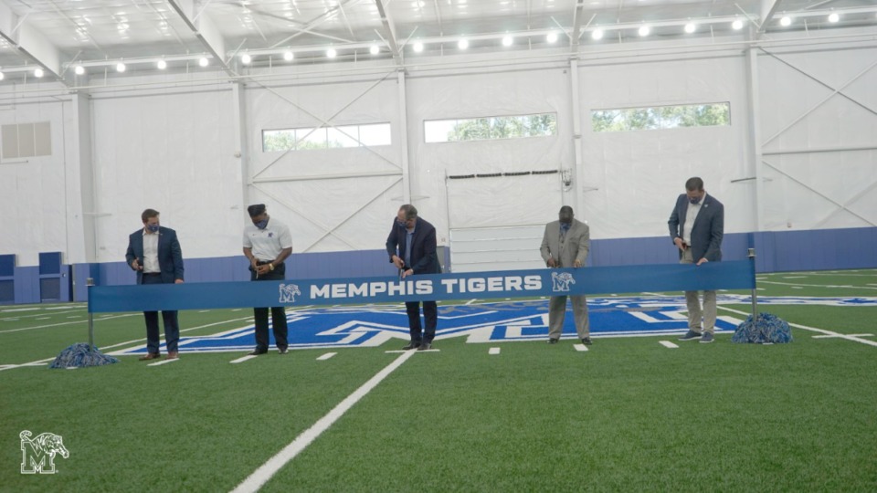 <strong>University of Memphis h<span>ead footballl coach Ryan Silverfield (left); senior linebacker JJ Russell, university president Dr. M. David Rudd, university board of trustees member Cato Johnson, and athletics director Laird Veatch&nbsp;</span>conduct the ceremonial ribbon-cutting for the new indoor practice facility on Wednesday, June 17, 2020.</strong><span>&nbsp;(Marcus Tompkins/Submitted photo)</span>
