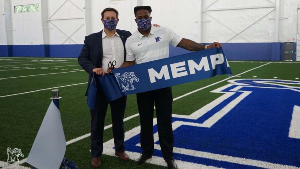 <strong>University of Memphis President David Rudd and senior linebacker JJ Russell at the ceremonial ribbon-cutting for the new indoor practice facility on Wednesday, June 17, 2020.</strong> (Marcus Tompkins/Submitted photo)