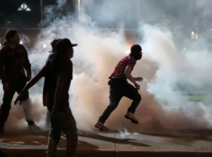 <strong>Protestors throw smoke bombs back at the Shelby County Sheriff's Deputies during a protest over the murder of George Floyd May 31, 2020.&nbsp;That same evening the SWAT team used tear gas after protesters threw bricks and bottles, Sheriff Floyd Bonner said.</strong> (Patrick Lantrip/Daily Memphian)