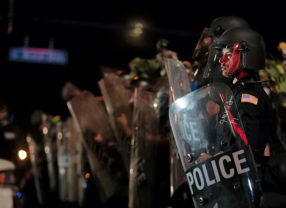 <strong>Since George Floyd's death, a proposal for hiring police officers and firefighters who live outside the city and county is getting another look. Pictured here, a Memphis Police officer looks out into the crowd during a May 28, 2020 protest over the death of George Floyd.</strong> (Patrick Lantrip/Daily Memphian file)