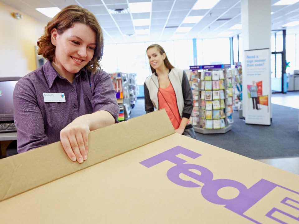 <strong>Everyone was all smiles at this FedEx Office in 2018, but today's news isn't anything to smile about.</strong> (Submitted)