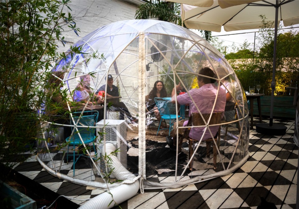 <strong>Patrons of The Beauty Shop dine in the new air-conditioned "dome" seating in the courtyard June 10, 2020.</strong> (Greg Campbell/Special to The Daily Memphian)