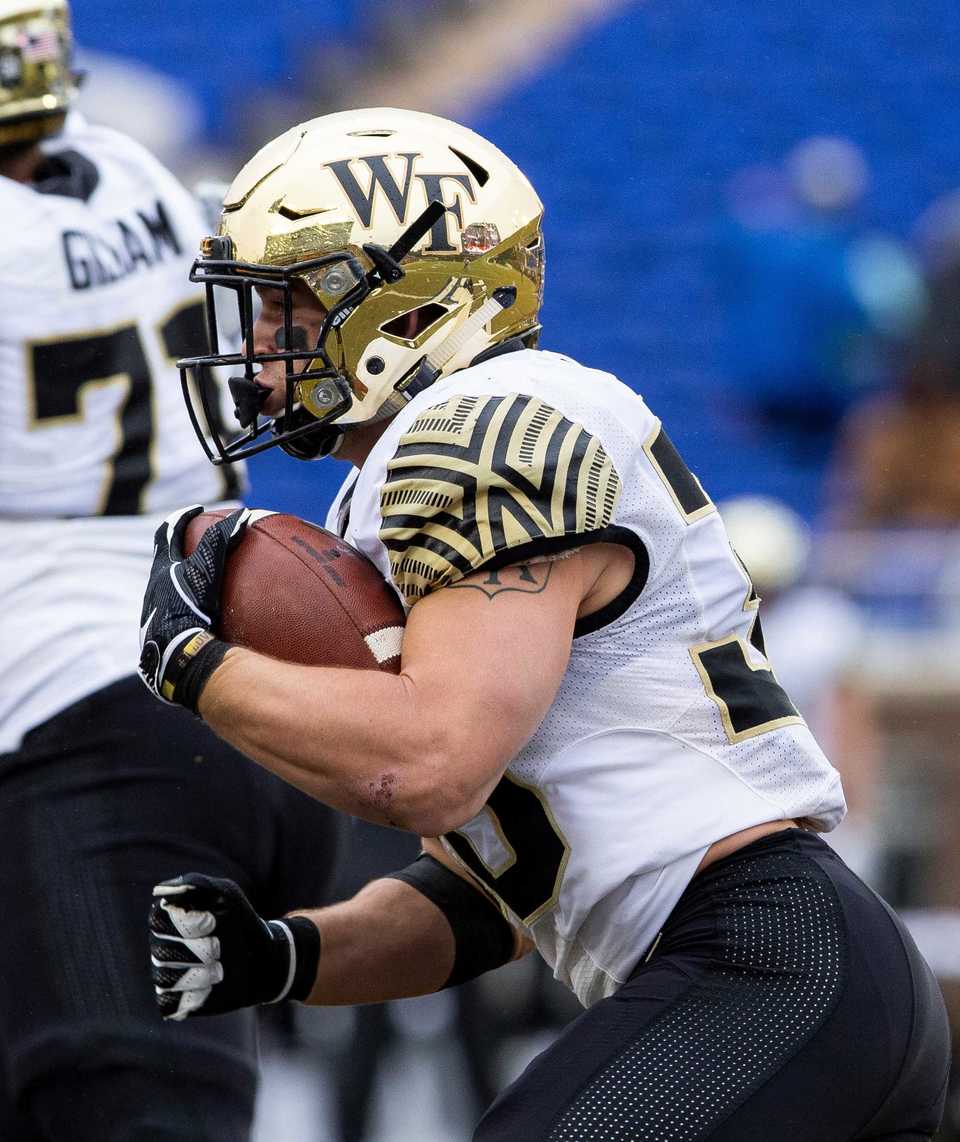 <strong>Wake Forest running back Cade Carney carries the ball against Duke in the Demon Deacons' season finale.</strong> (Ben McKeown/Associated Press)