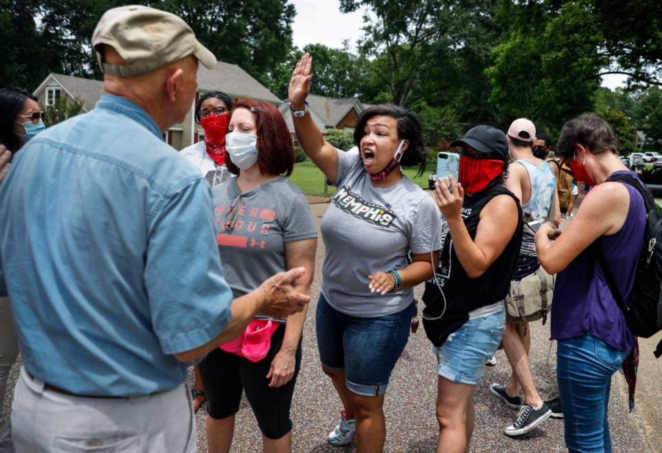 <strong>Memphis activist Theryn C. Bond (middle) has a heated conversation with Tim Treadwell (left) on Monday, June 29, 2020, while protesting outside of the home of Lloyd Crawford in Germantown.</strong> (Mark Weber/Daily Memphian)