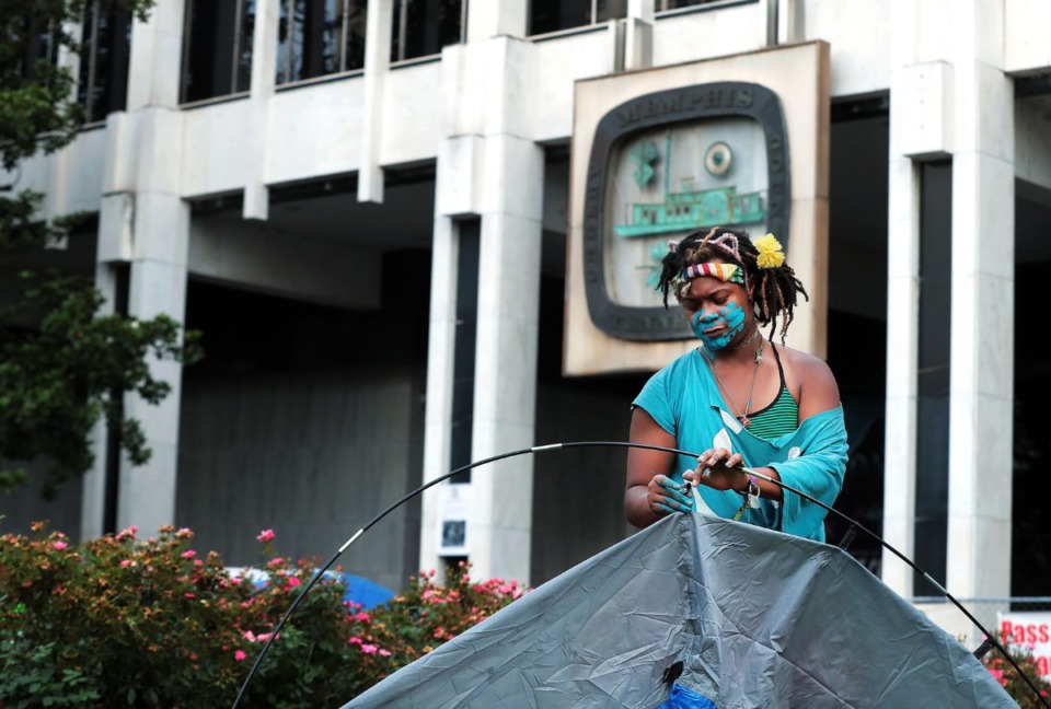 <strong>Salamander helps set up tent on the lawn of Memphis City Hall to help shelter Memphis' homeless population June 30, 2020.</strong>(Patrick Lantrip/Daily Memphian)