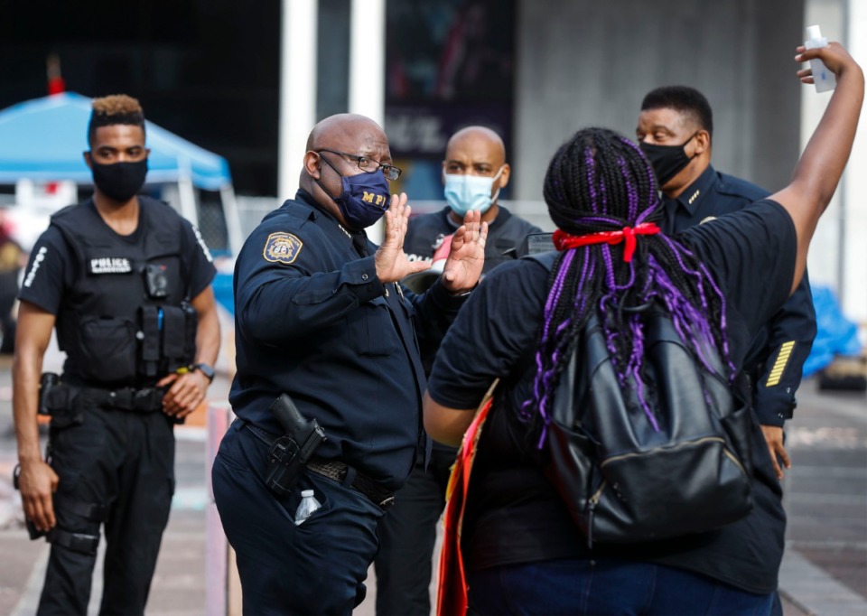 <strong>Memphis Police Deputy Chief Micheal Hardy (middle) talks to a protester outside City Hall on Wednesday, July 1, 2020.</strong> (Mark Weber/Daily Memphian)