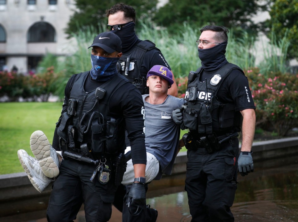 <strong>Police remove a protester outside City Hall on Wednesday, July 1, 2020.</strong> (Mark Weber/Daily Memphian)