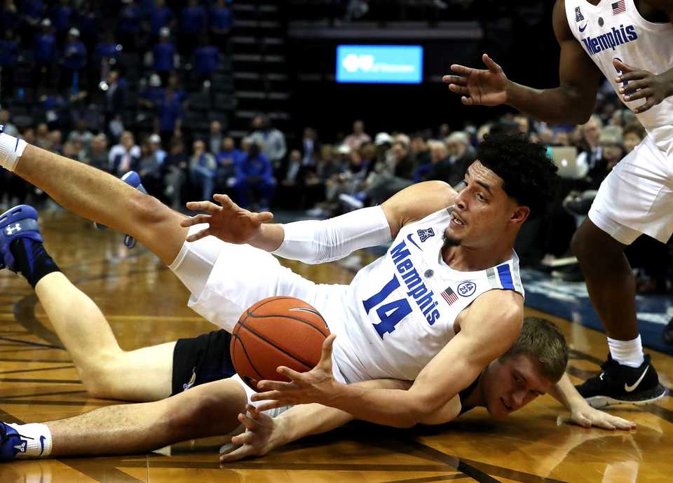 <strong>University of Memphis forward Isaiah Maurice (14) dives for a loose ball during a game against South Dakota State.</strong> (Houston Cofield/Daily Memphian)