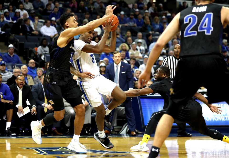 <strong>Memphis Tiger guard Jeremiah Martin (3) charges toward the basket.</strong> (Houston Cofield/Daily Memphian)